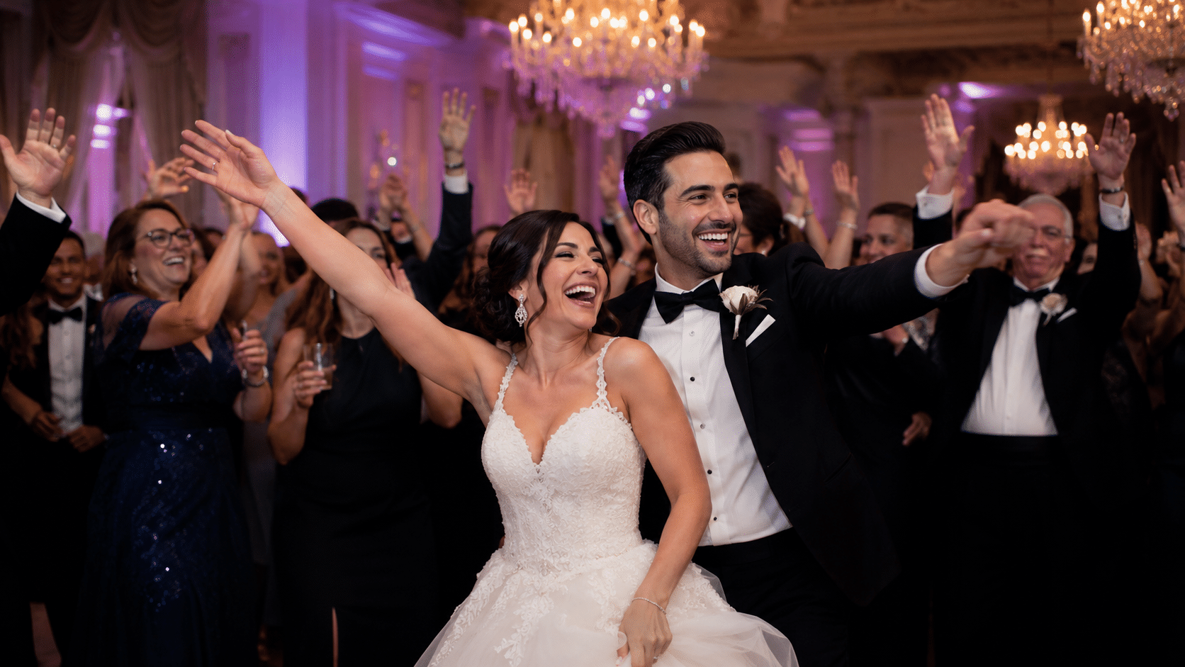 Bride and groom celebrating with guests on the dance floor